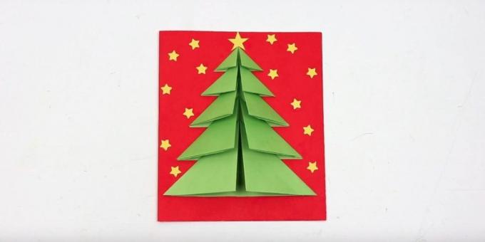 kartu Natal dengan pohon Natal di sampul volume
